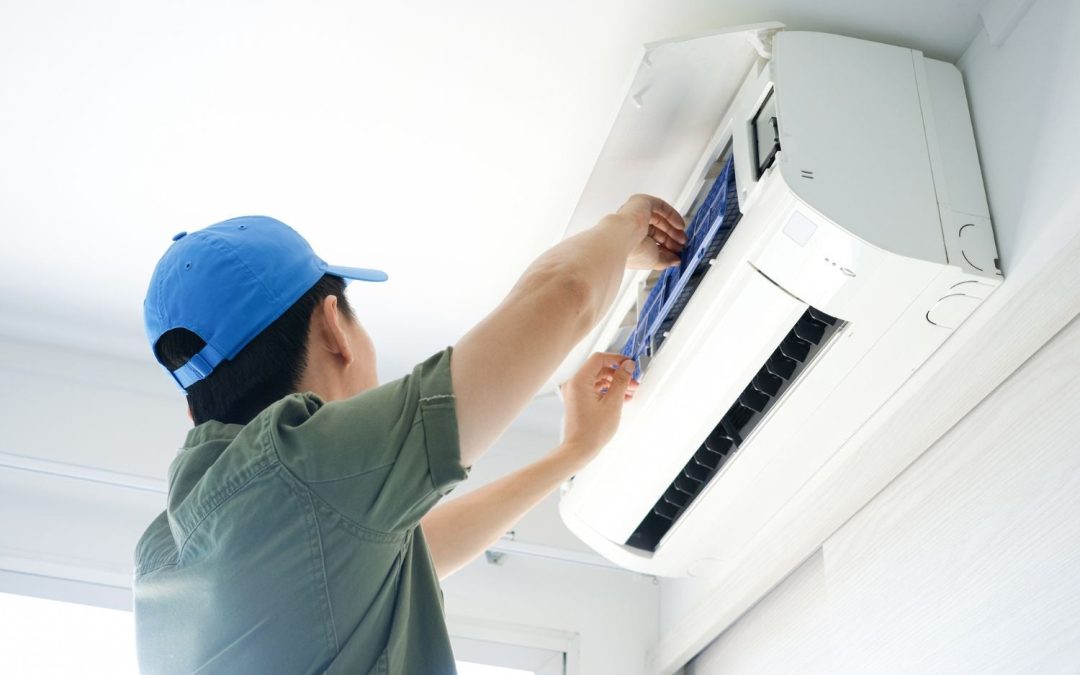 Air conditioning technician maintaining an indoor mini split system in Golden, CO